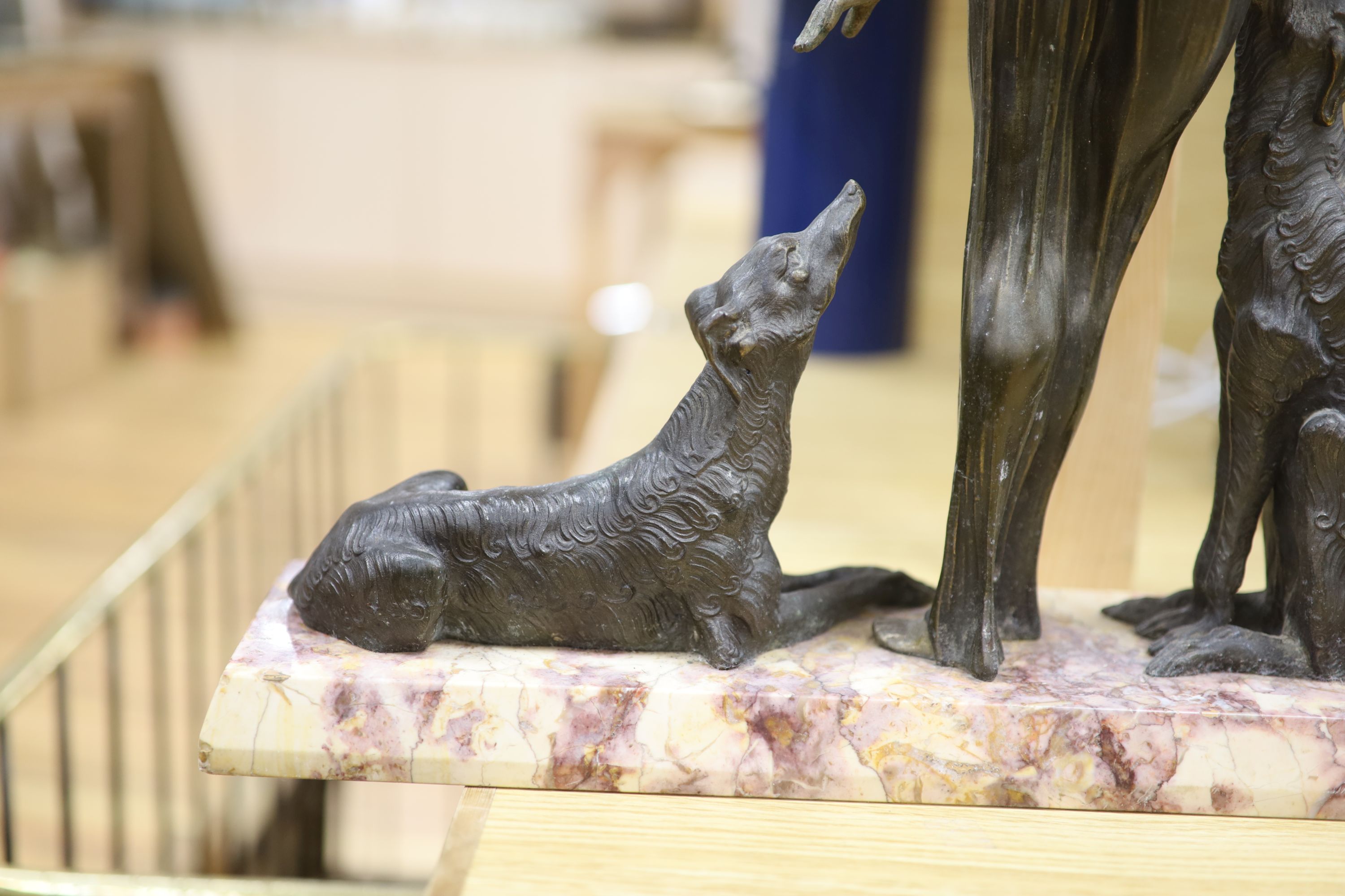 A Spelter Art Deco figure of a dog and borzoi, on a marble base, height 45cm